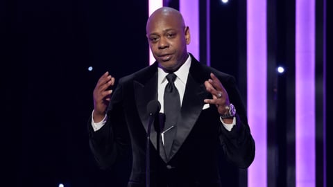 Dave Chappelle Knocks Republican Party for “Weaponized” Transgender Jokes: “That’s Not What I Was Doing”
