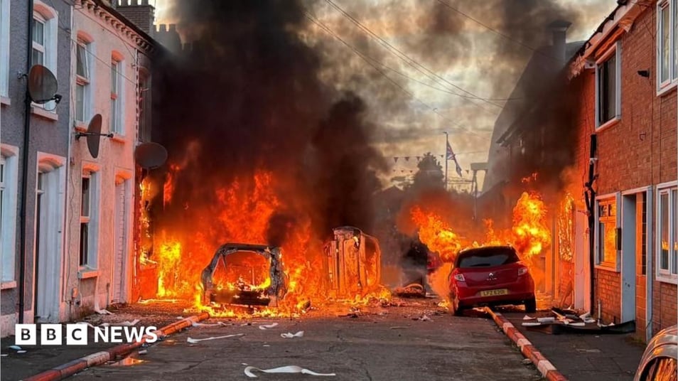 Homes set on fire in Belfast night of violence as MP says people were targeted based on skin colour - follow live